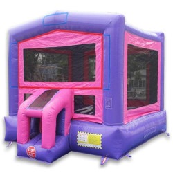 Pink castle bounce house with tables and chairs